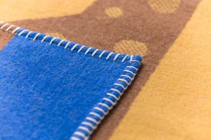 LILI baby blanket "giraffe" with embroidery in . Blanket made by David Fussenegger , a family-run mill in Austria.