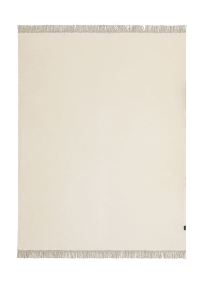 VIENNA throw solid with fringe in offwhite . Throw Blanket made by David Fussenegger , a family-run mill in Austria.