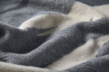 SAVONA throw "skis & tracks" in . Throw Blanket made by David Fussenegger , a family-run mill in Austria.