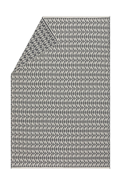 NOVA throw "small ethnic pattern" in charcoal . Throw Blanket made by David Fussenegger , a family-run mill in Austria.