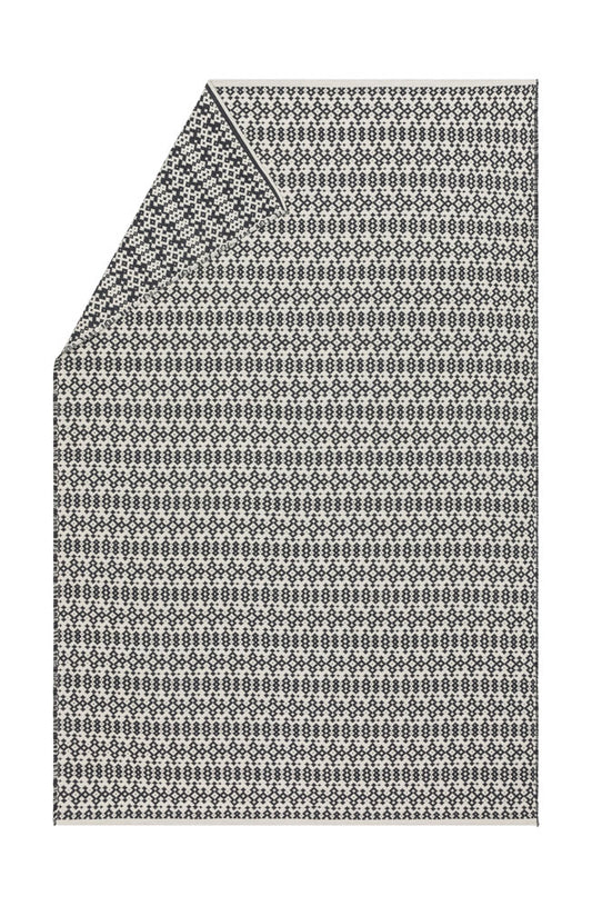 NOVA throw "small ethnic pattern" in charcoal . Throw Blanket made by David Fussenegger , a family-run mill in Austria.
