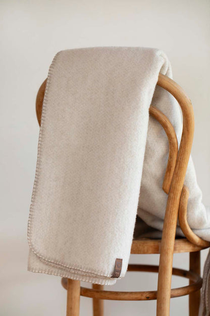 MERANO throw "faux solid"