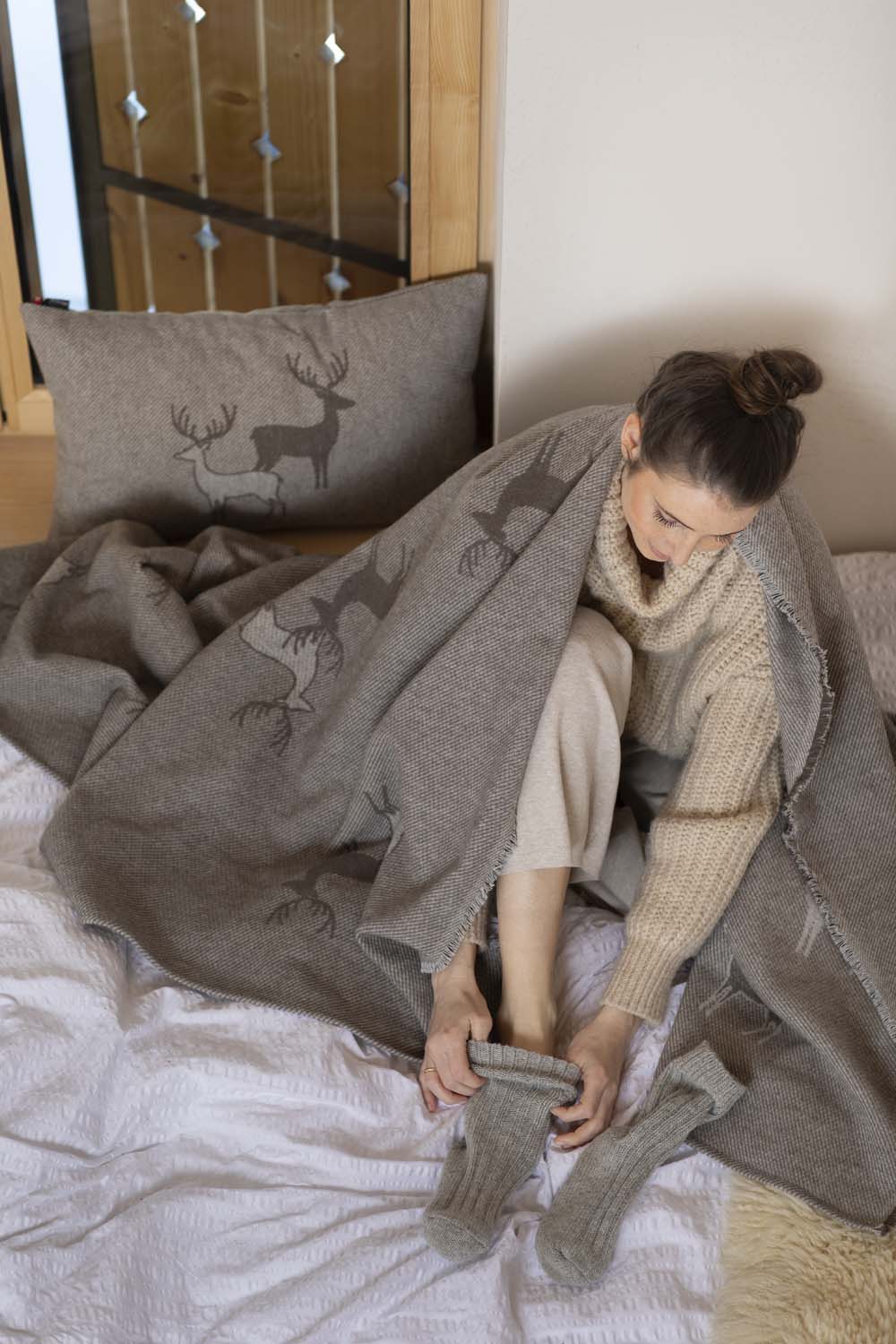 LUCA throw "pairs of stags" in . Throw Blanket made by David Fussenegger , a family-run mill in Austria.