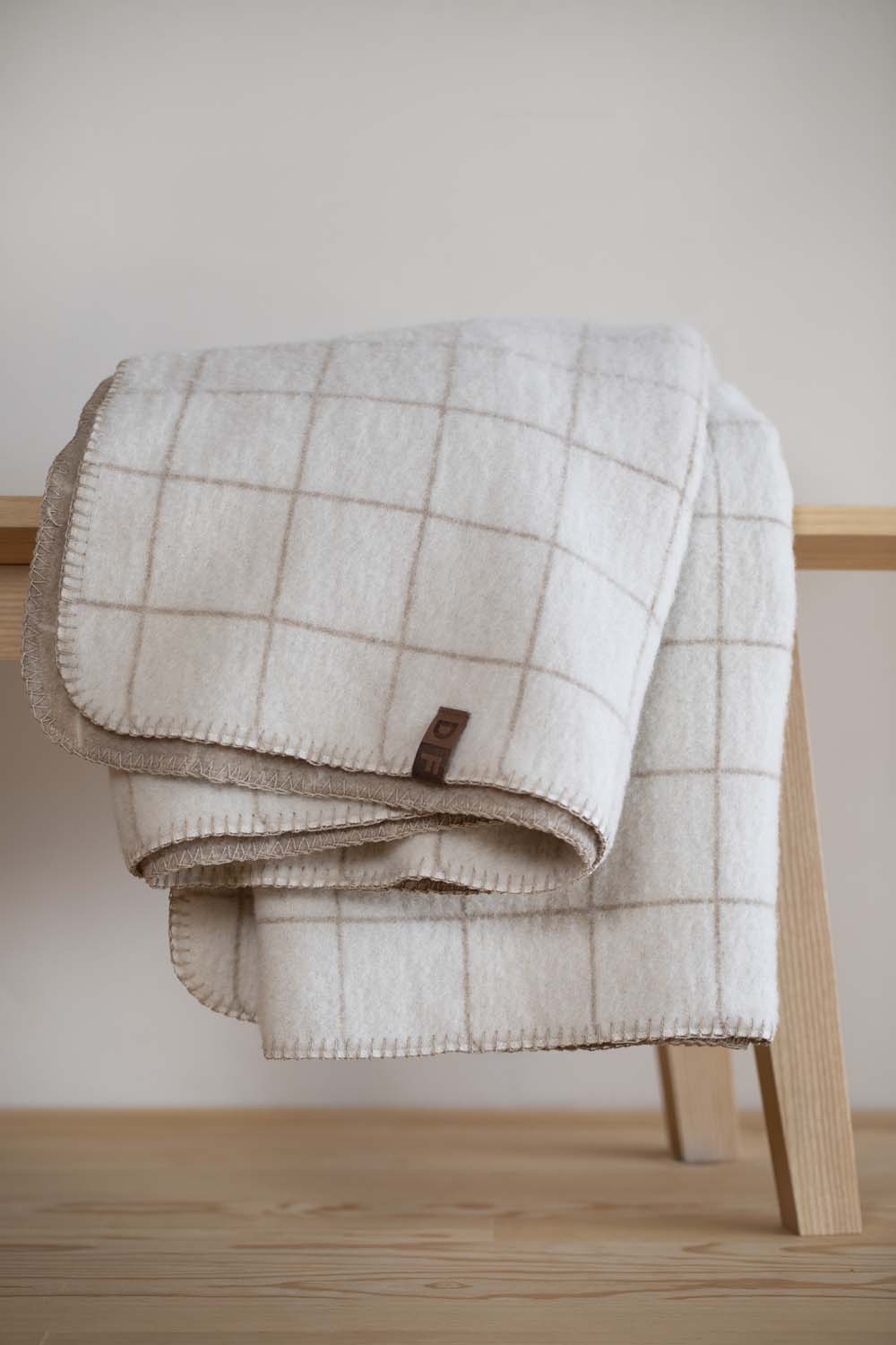 MERANO throw "checkered" in . made by INDIGO 11 , a family-run mill in Austria.
