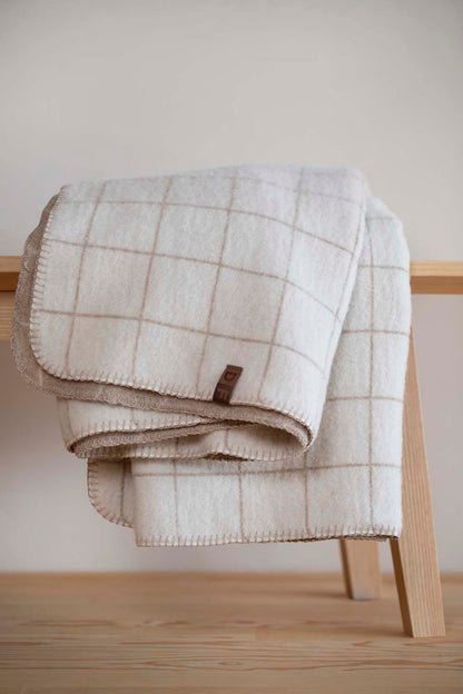 MERANO throw "checkered" in . made by INDIGO 11 , a family-run mill in Austria.