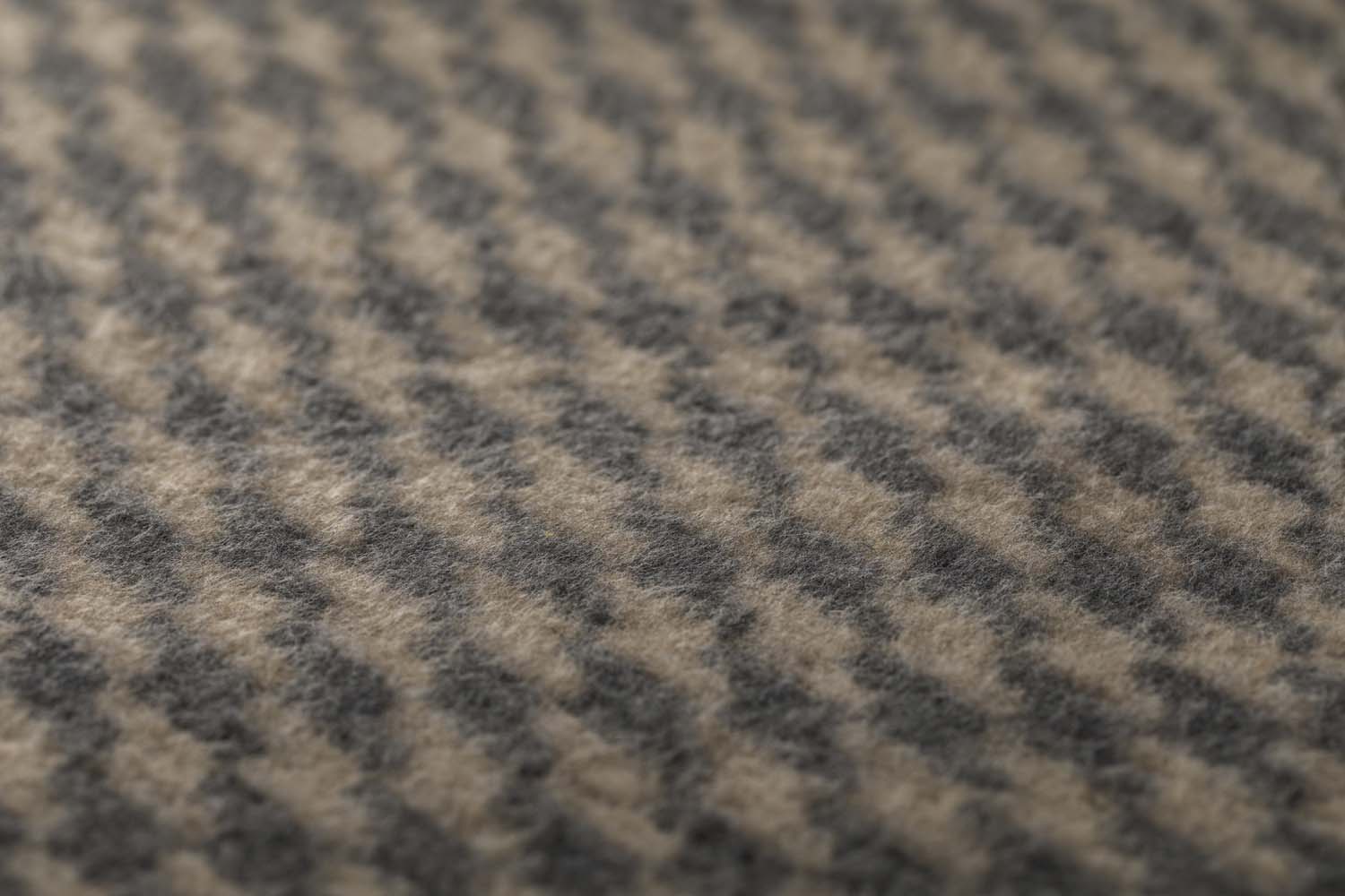 MERANO throw "houndstooth" in . made by INDIGO 11 , a family-run mill in Austria.