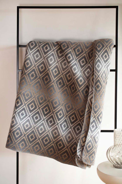 SAVONA throw "lozenge shapes gradient" in . Throw Blanket made by David Fussenegger , a family-run mill in Austria.