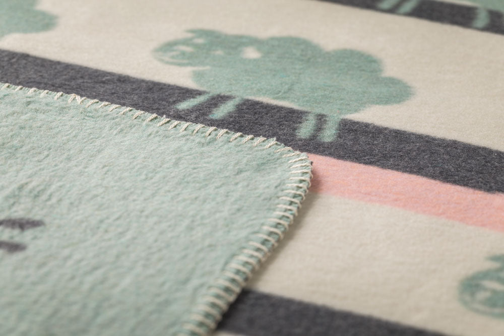 MILA baby blanket "sheep allover" in . Blanket made by David Fussenegger , a family-run mill in Austria.