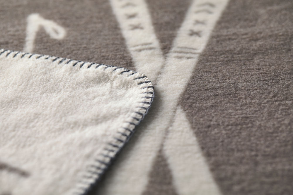 SAVONA throw "skis & tracks" in . Throw Blanket made by David Fussenegger , a family-run mill in Austria.