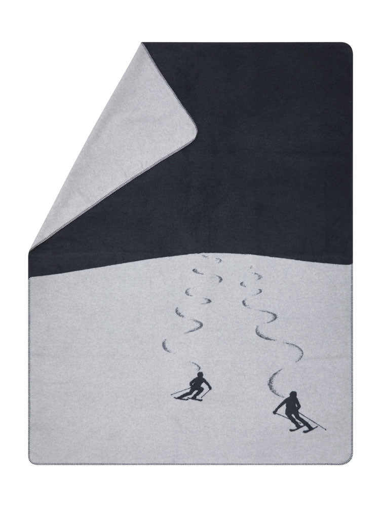 SAVONA throw "skiers leaving tracks" in charcoal . Throw Blanket made by David Fussenegger , a family-run mill in Austria.
