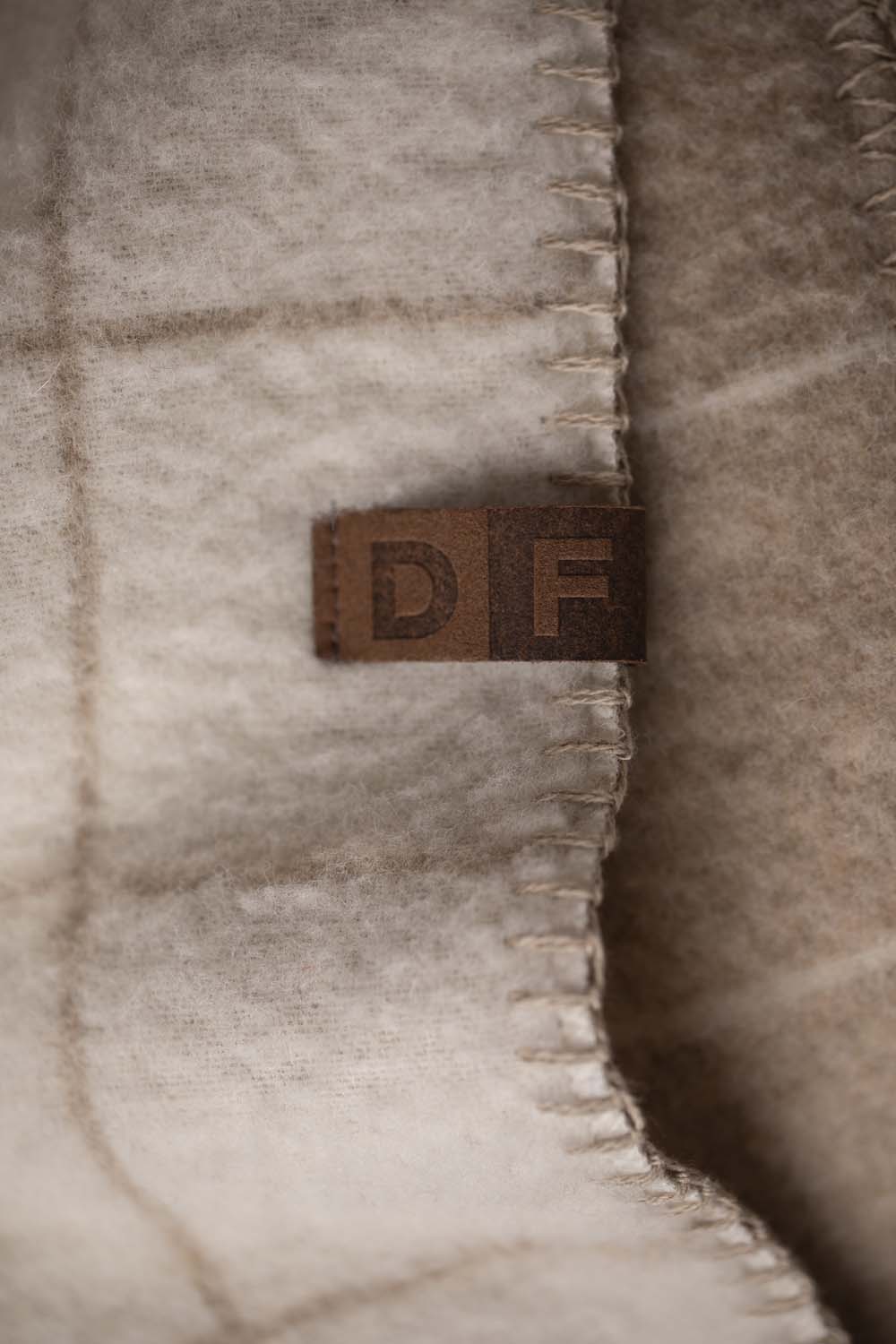 MERANO throw "checkered" in . made by INDIGO 11 , a family-run mill in Austria.