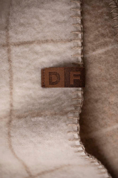 MERANO throw "checkered" in . made by INDIGO 11 , a family-run mill in Austria.