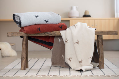 SAVONA throw "deer allover" in . Throw Blanket made by David Fussenegger , a family-run mill in Austria.