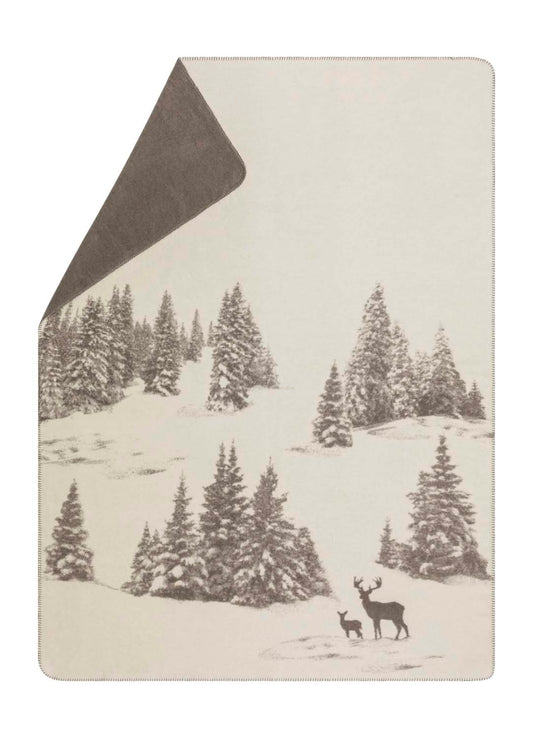 SAVONA throw "snowy trees/stag" in offwhite . Throw Blanket made by David Fussenegger , a family-run mill in Austria.