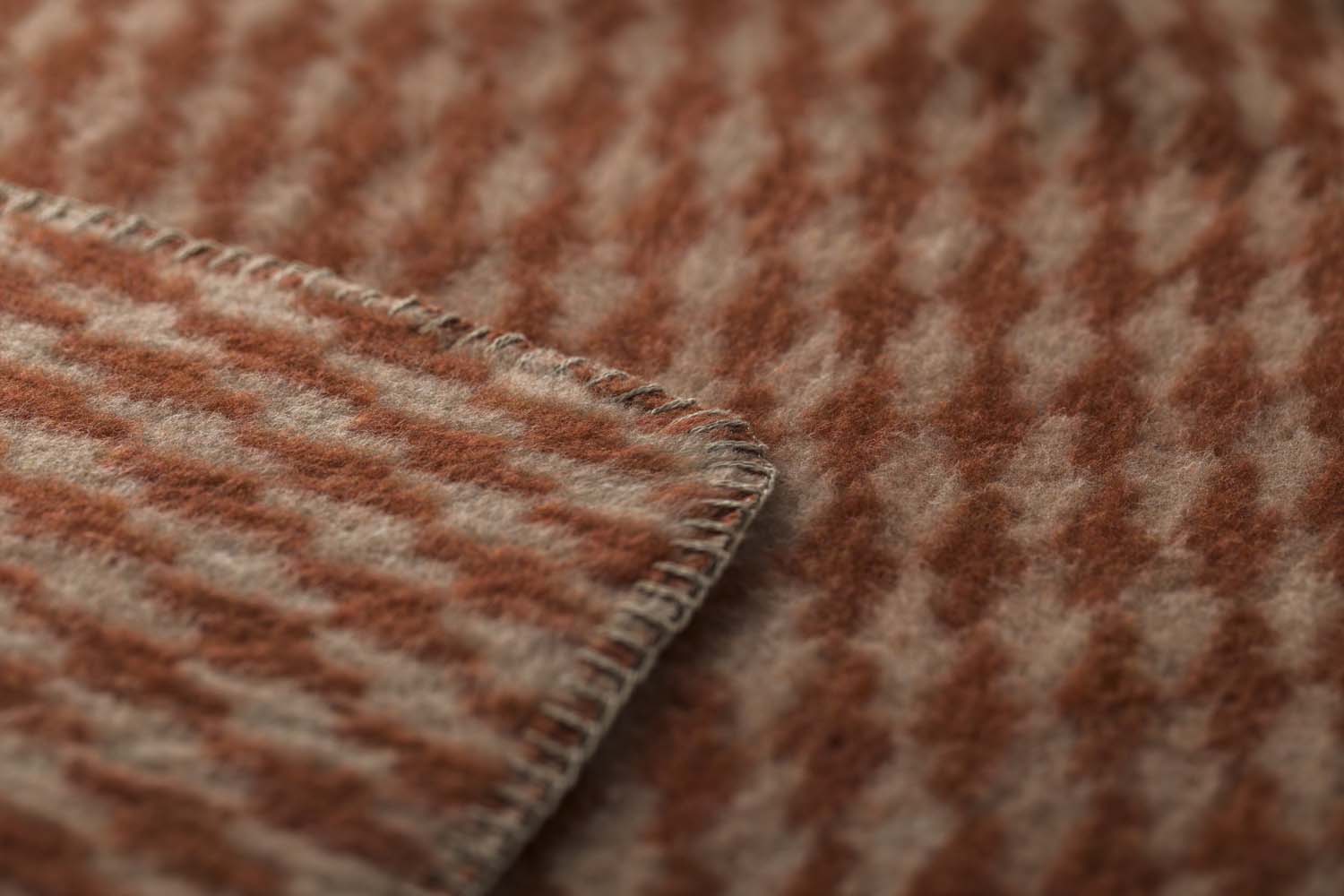 MERANO throw "houndstooth" in . made by INDIGO 11 , a family-run mill in Austria.