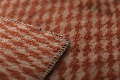 MERANO throw "houndstooth" in . made by INDIGO 11 , a family-run mill in Austria.