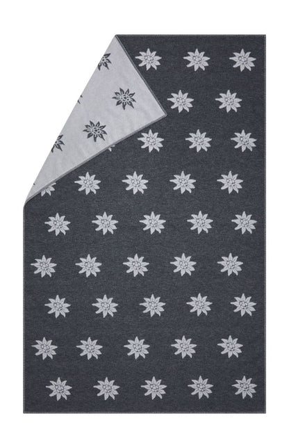 CARLA throw "Edelweiß" in charcoal . Throw Blanket made by David Fussenegger , a family-run mill in Austria.