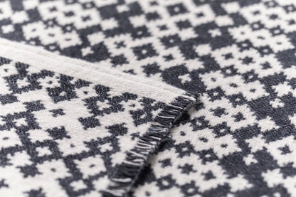 NOVA throw "small ethnic pattern" in . Throw Blanket made by David Fussenegger , a family-run mill in Austria.