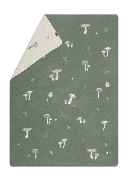 SILVRETTA throw "mushrooms'n more" in ivy . Throw Blanket made by David Fussenegger , a family-run mill in Austria.