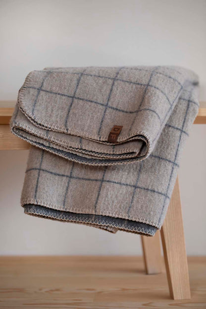 MERANO throw "checkered" in . made by INDIGO 11 , a family-run mill in Austria.