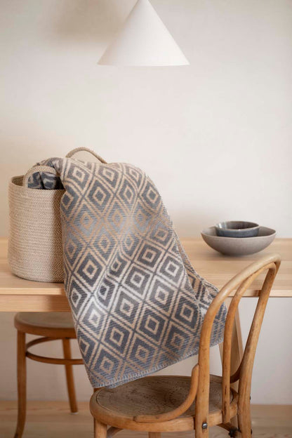 SAVONA throw "lozenge shapes gradient" in . Throw Blanket made by David Fussenegger , a family-run mill in Austria.