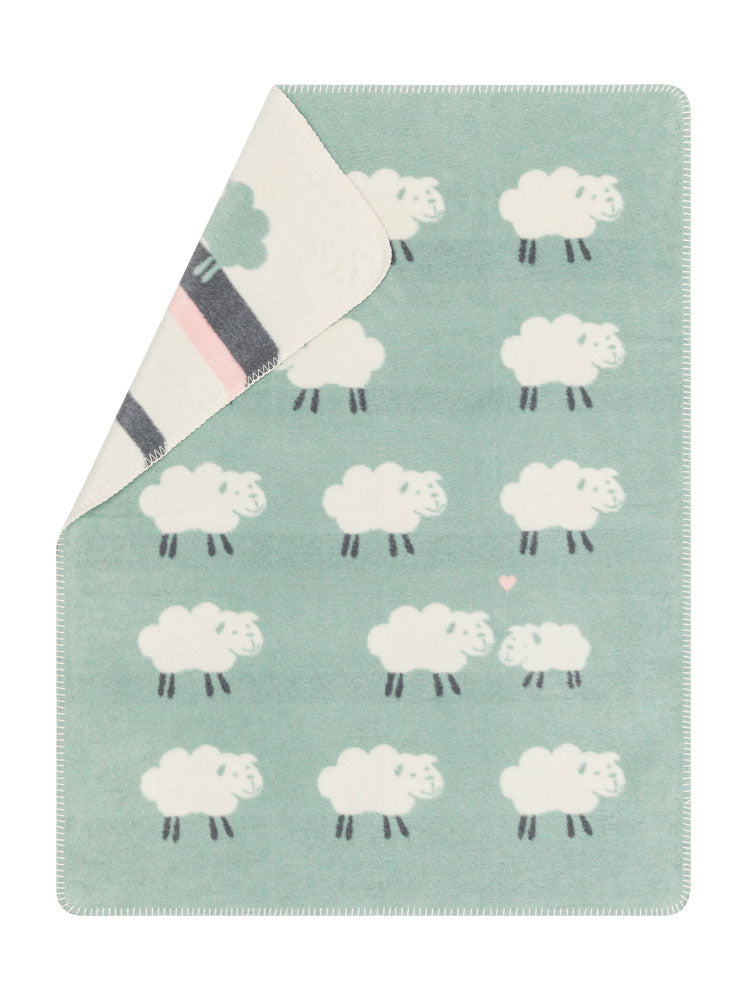 MILA baby blanket "sheep allover" in light green . Blanket made by David Fussenegger , a family-run mill in Austria.