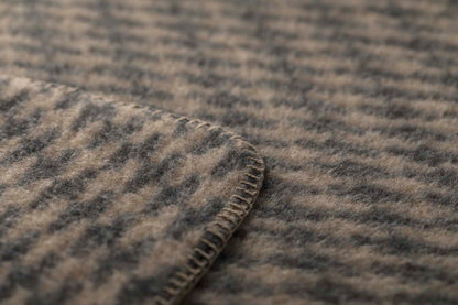 MERANO throw "houndstooth" in . made by INDIGO 11 , a family-run mill in Austria.